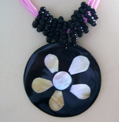 white mop and receine necklace
