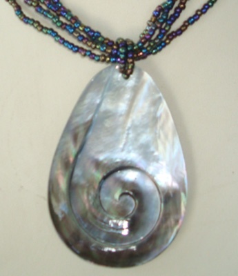 black shell carving with bead